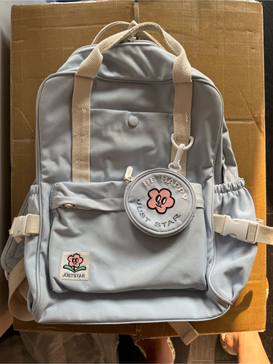 Light Blue Backpack with "Be Happy" Charm