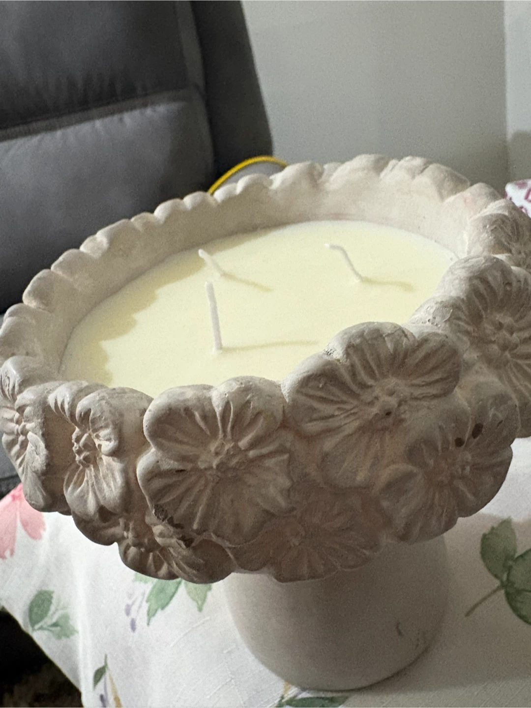 Large decorative candle with floral accents