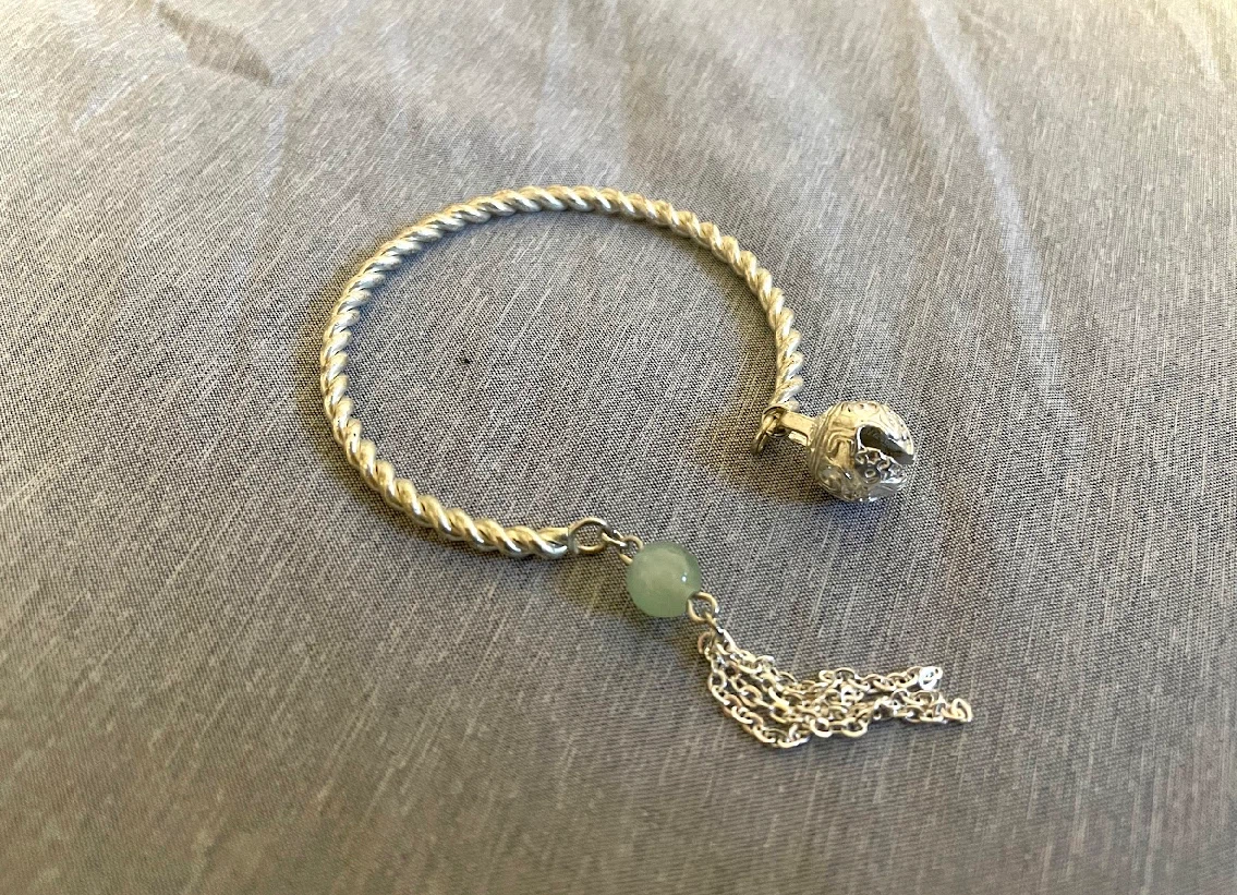 Silver bracelet with bell
