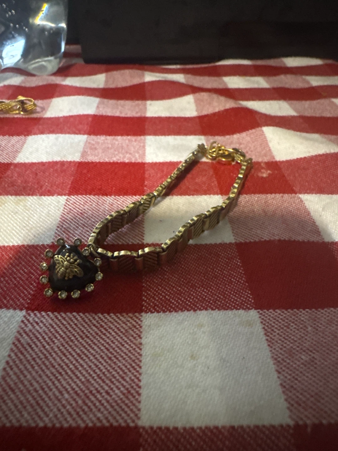 Gold tone bracelet with bee charm