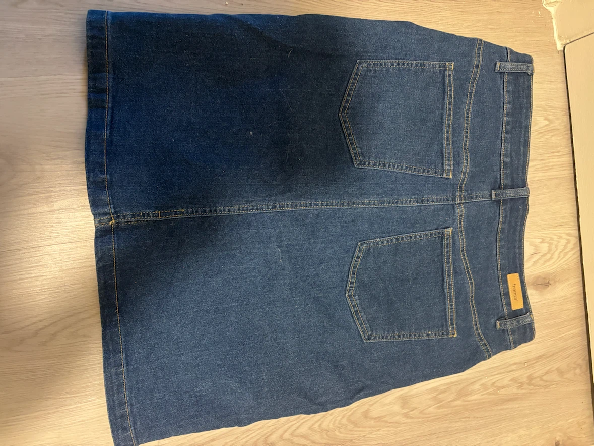 Denim Skirt small slit in front.