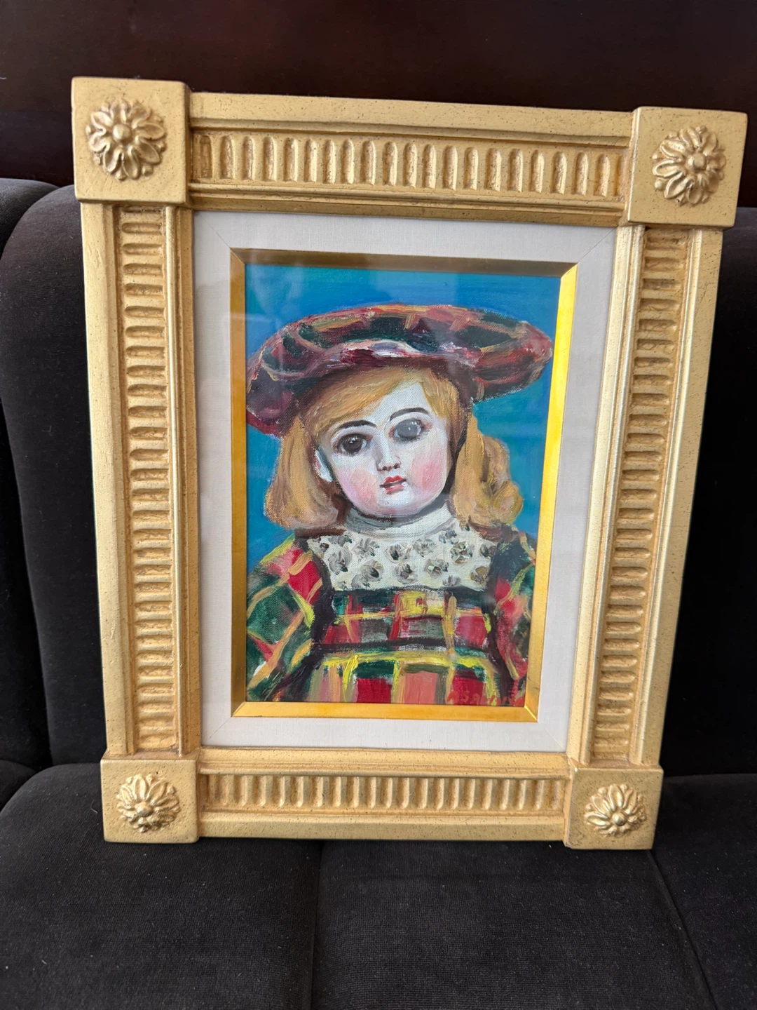 Framed Painting of a Doll