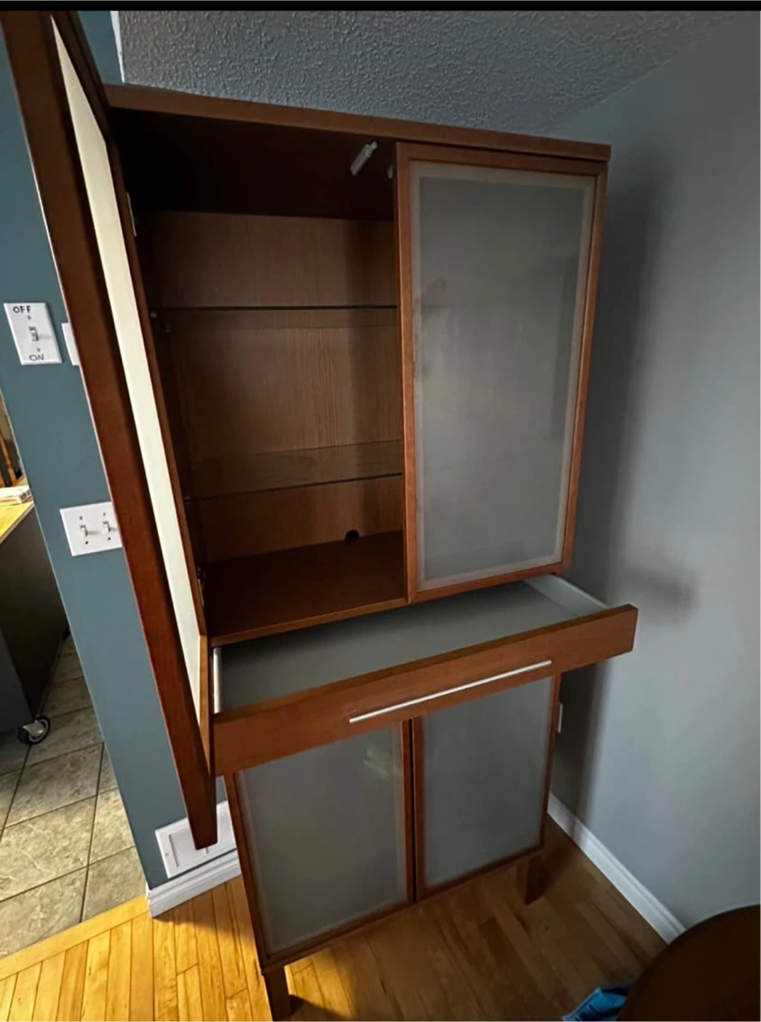 Wooden cabinet with frosted glass doors
