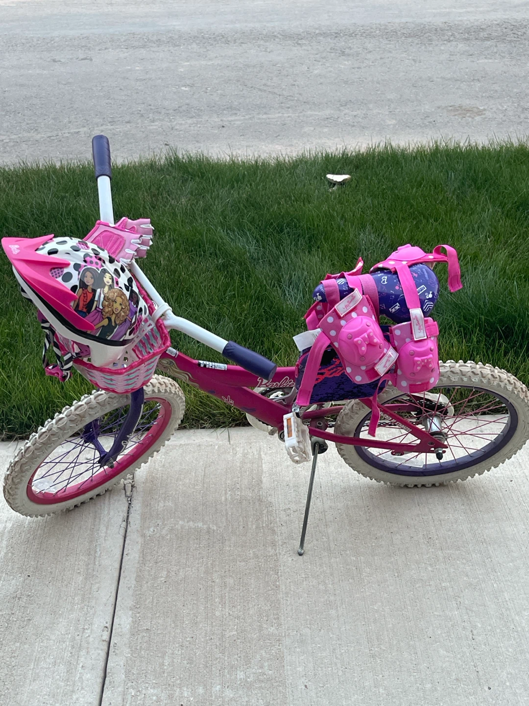 Barbie Kids Bicycle with a matching helmet and a protective gear