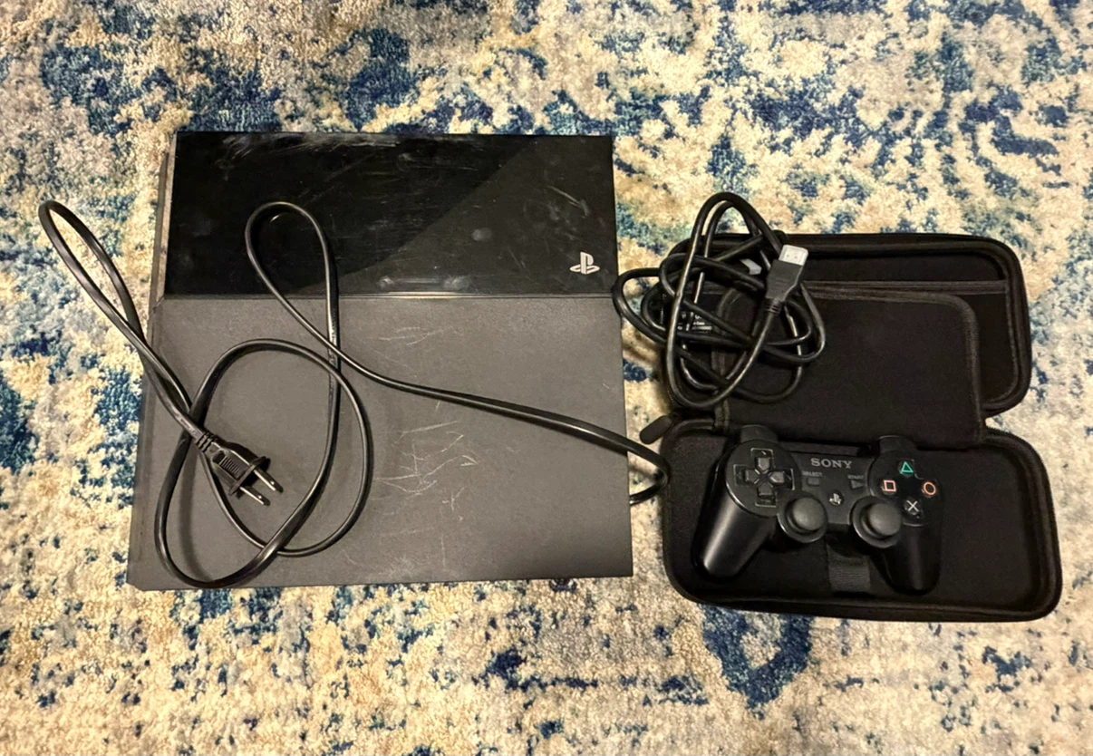 500GB PS4 with a controller and 9 games