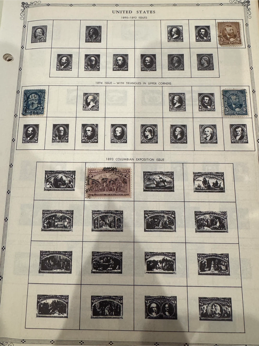 Old US Postage Stamps On Pages