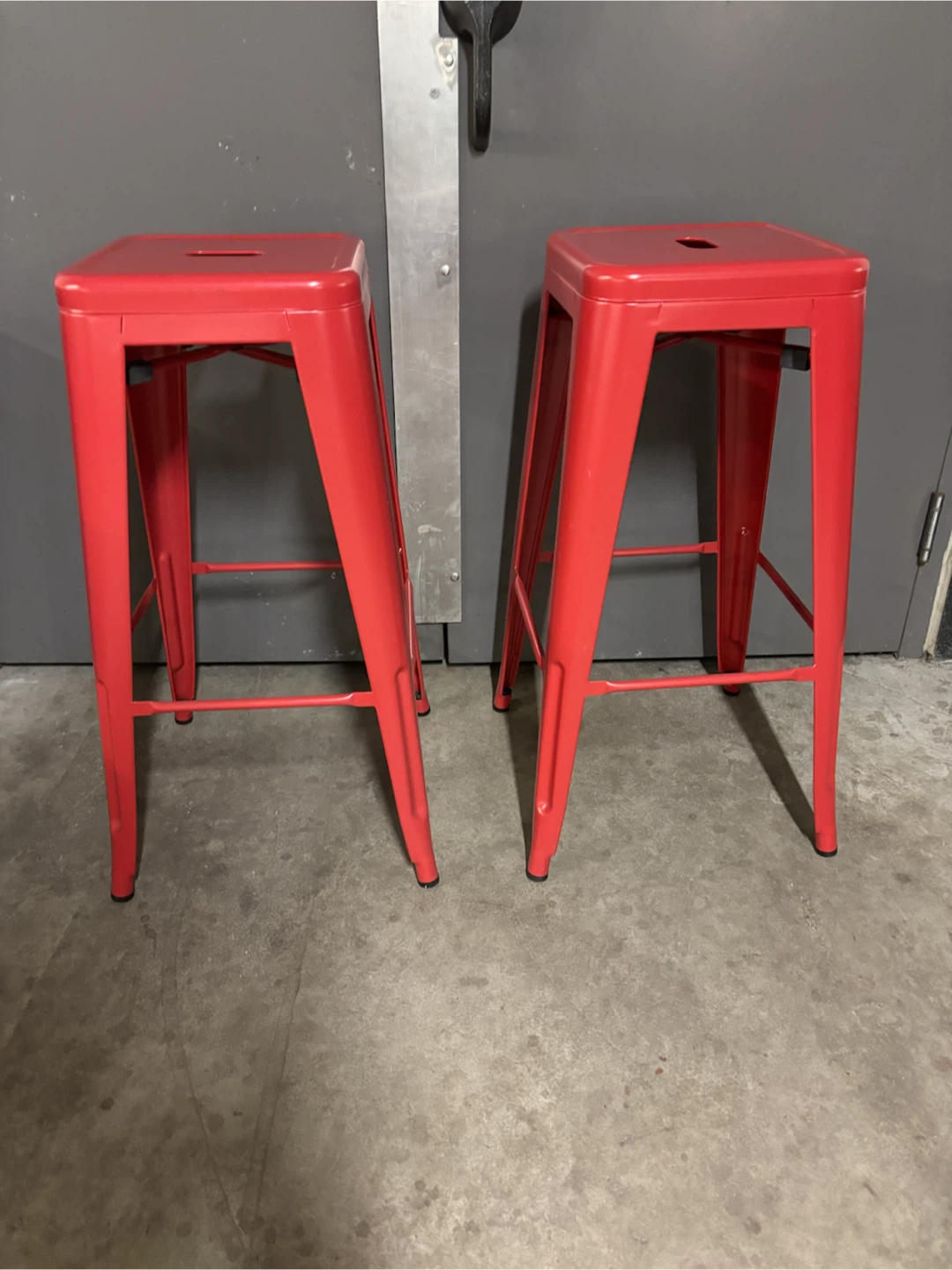 Two Red Metal Counter Stools