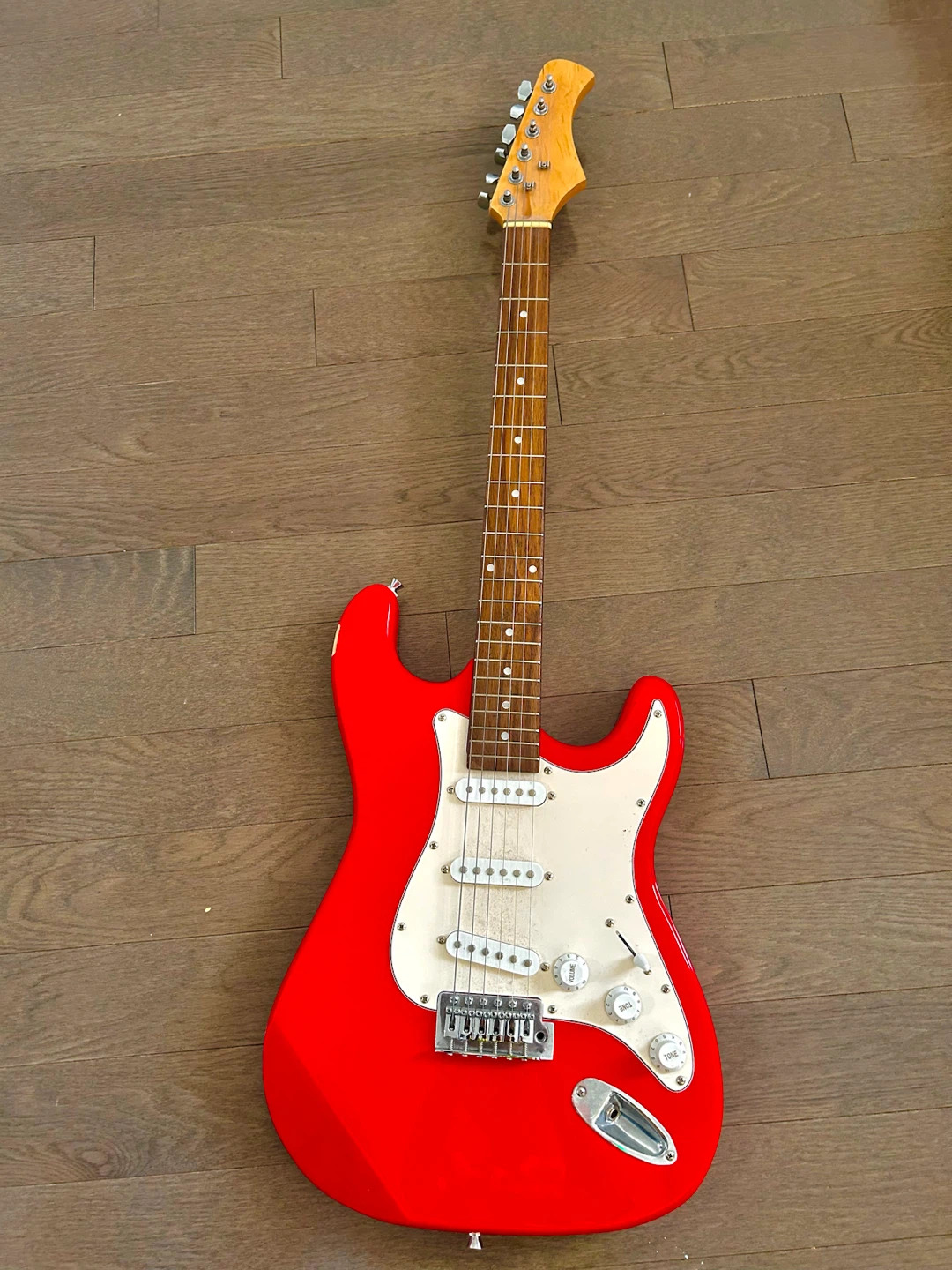 Red Electric Guitar with White Pickguard
