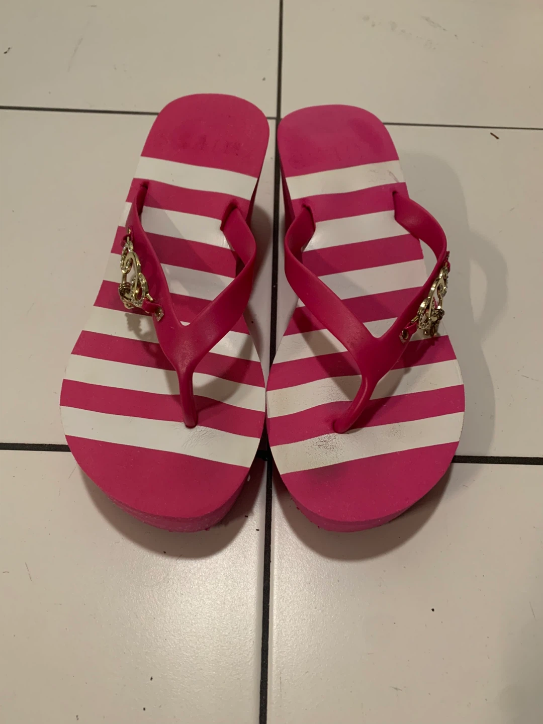 Pink and white striped wedge flip-flops