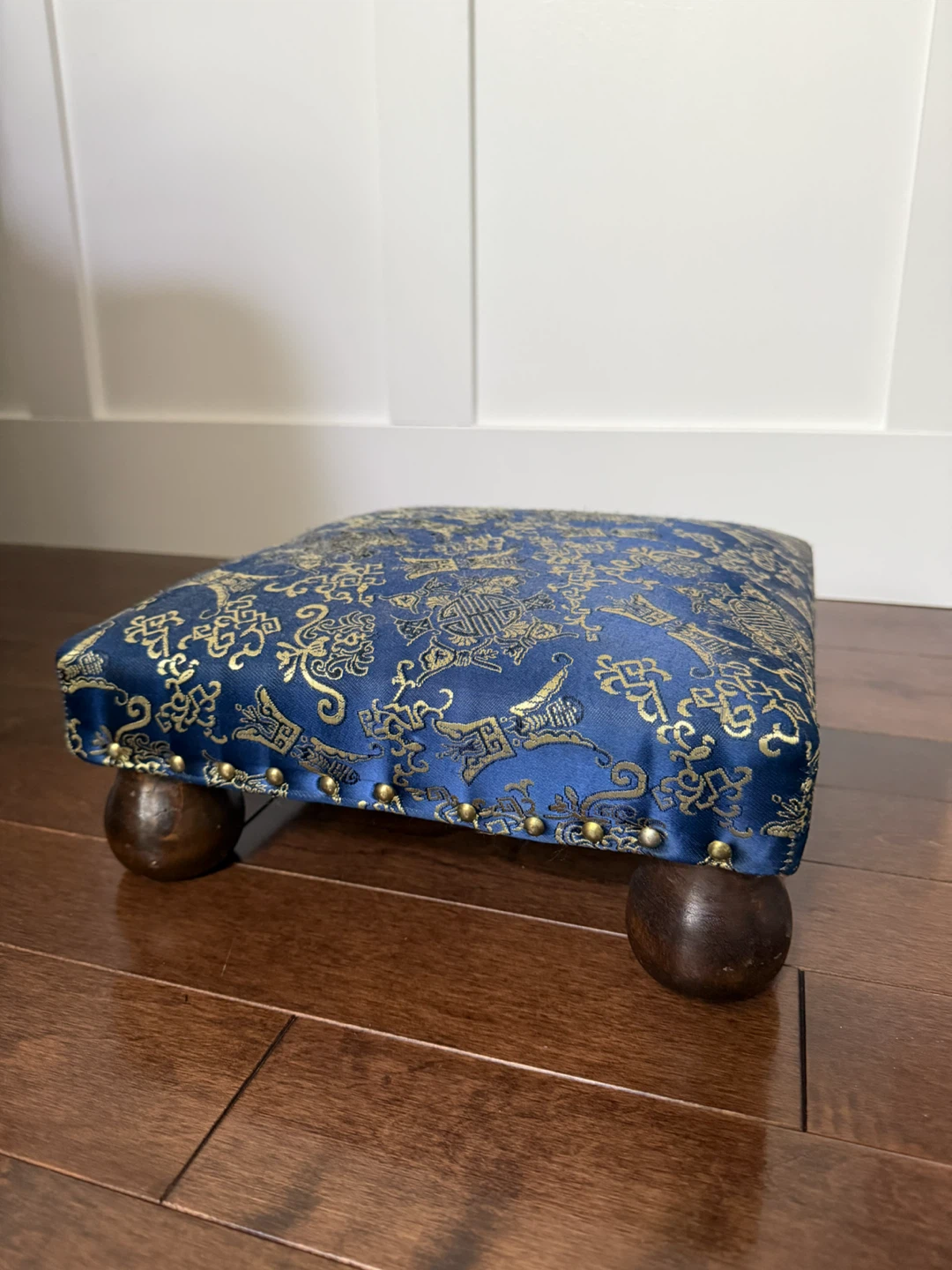 Blue footstool with gold pattern