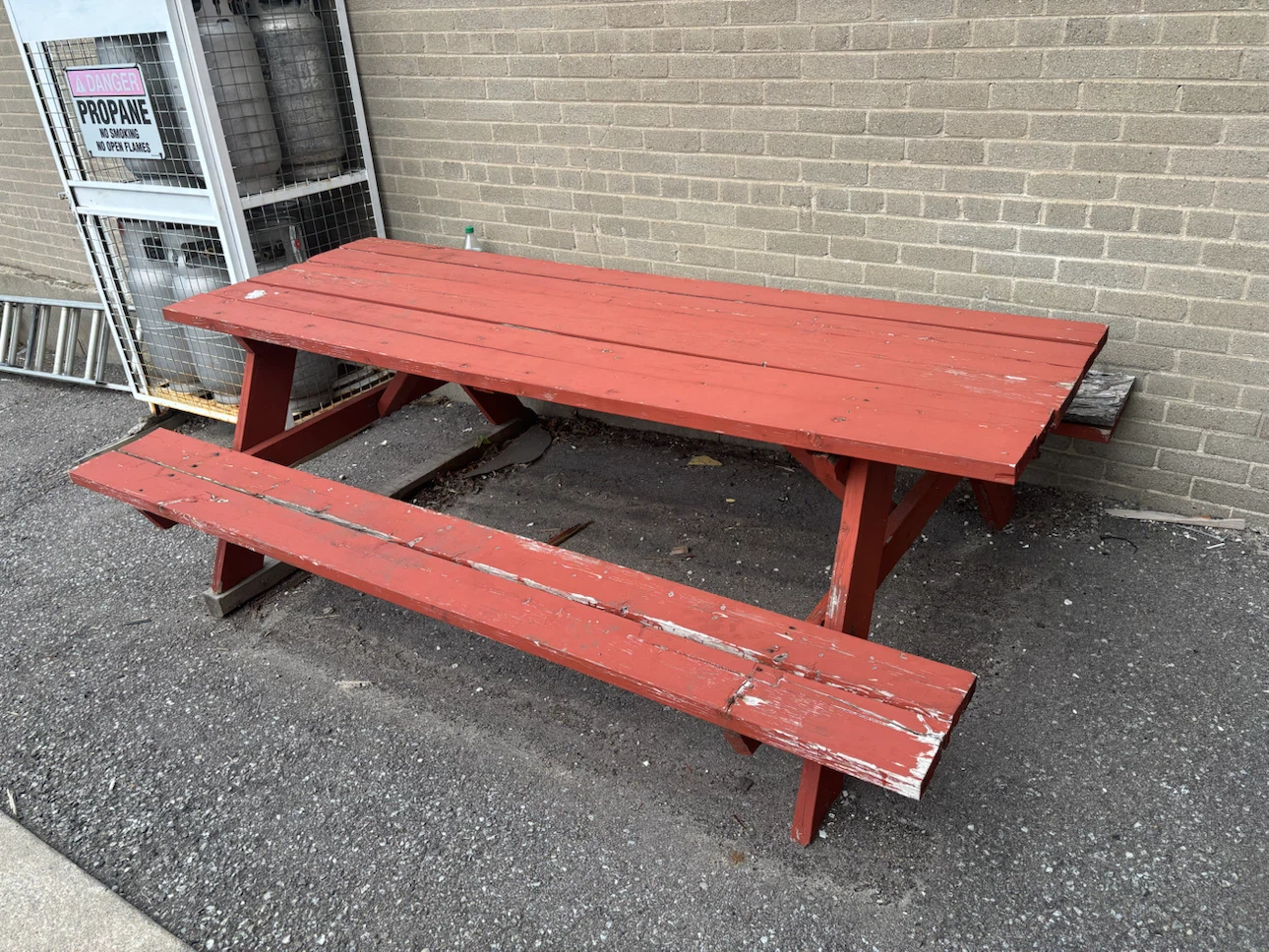 Red Wooden Picnic Table with Attached Benches
