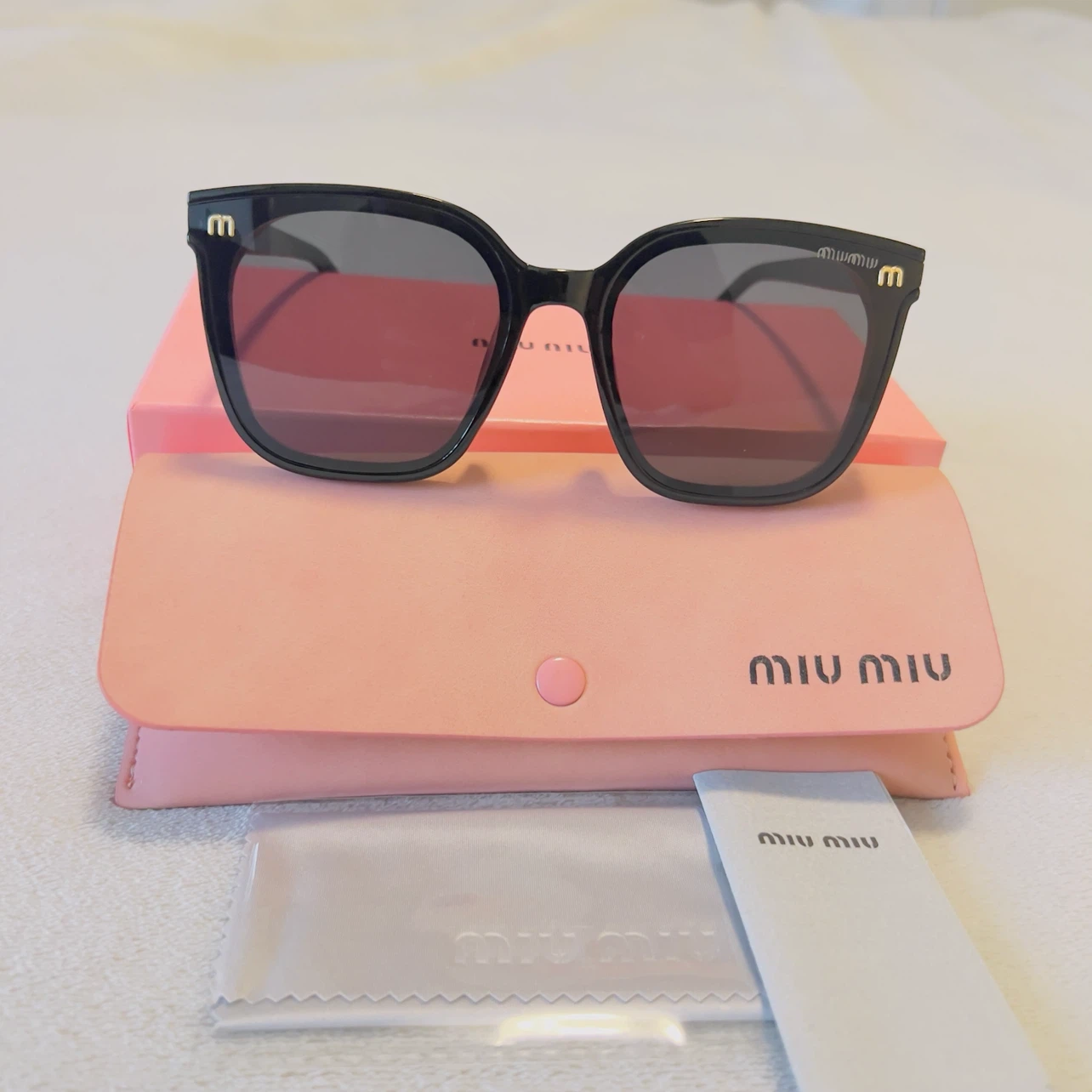 Miu Miu Black Cat-Eye Sunglasses with Case