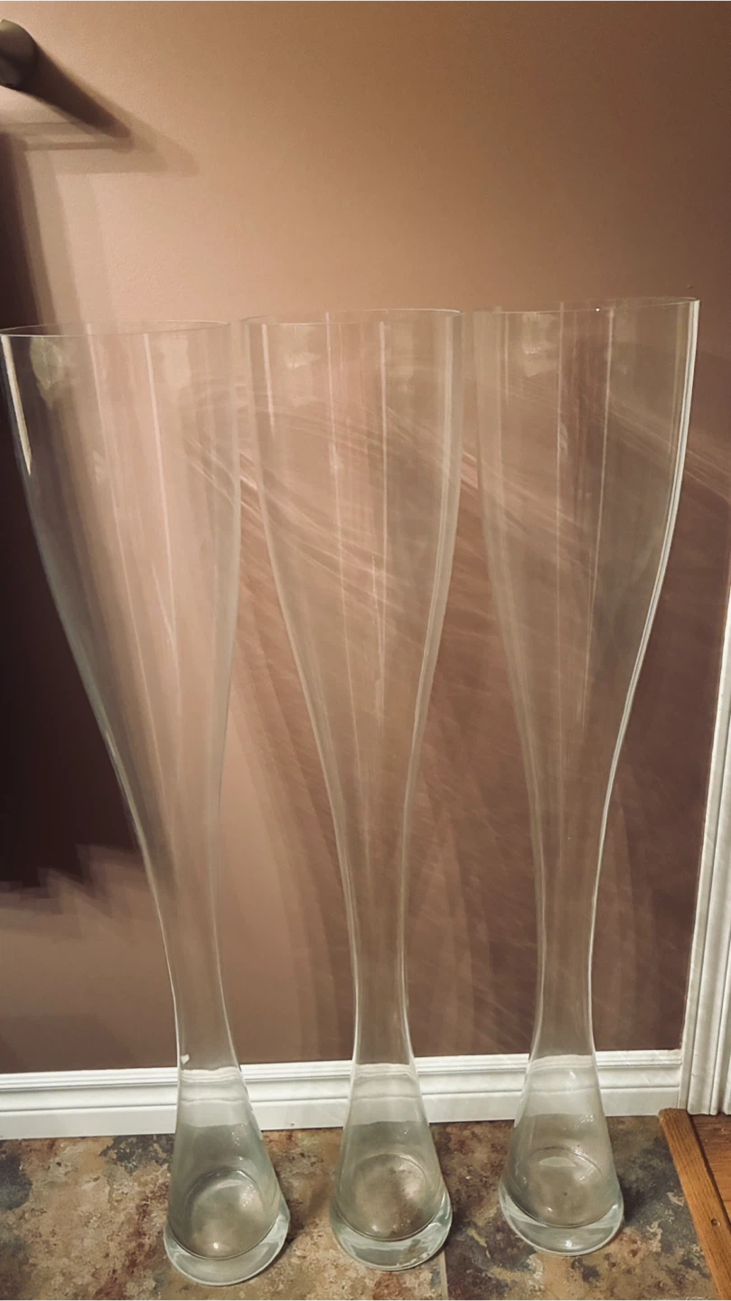 Three 40” high glass vases