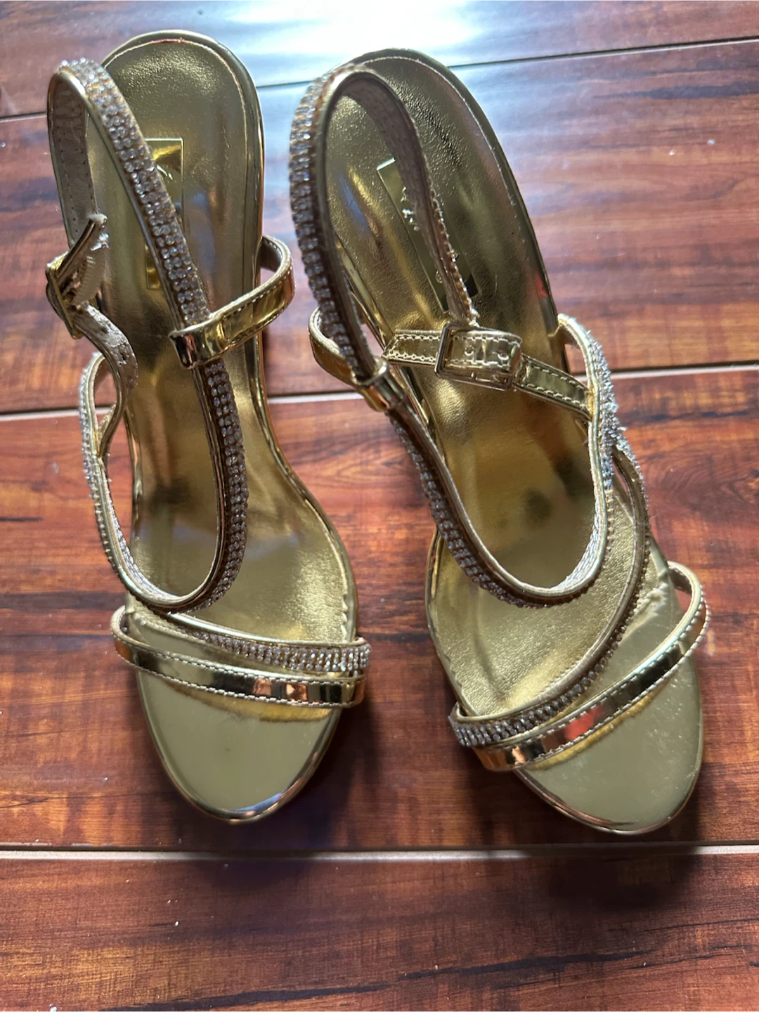 Gold strappy high heels with rhinestones