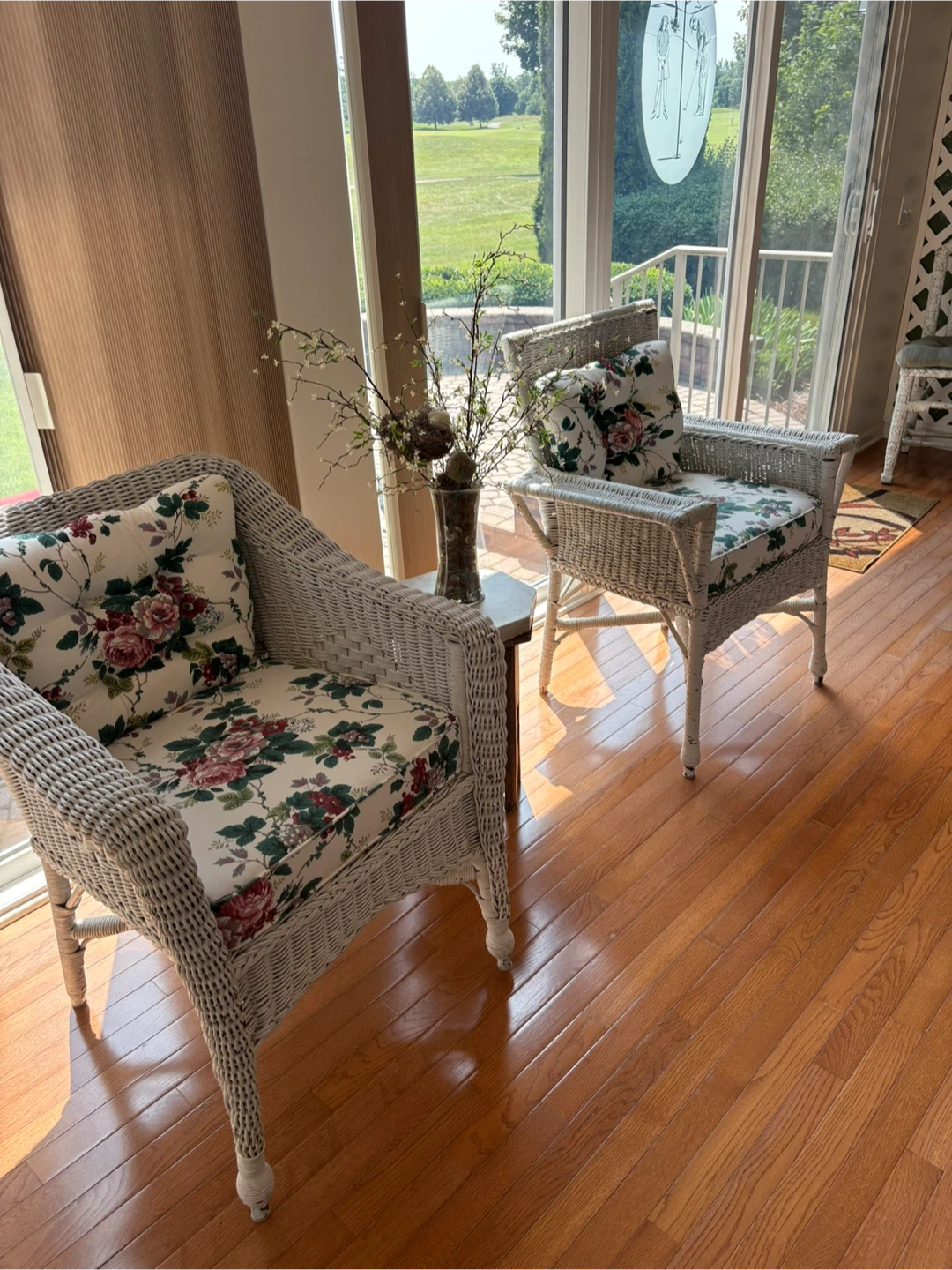 Wicker Loveseat with Floral Cushions