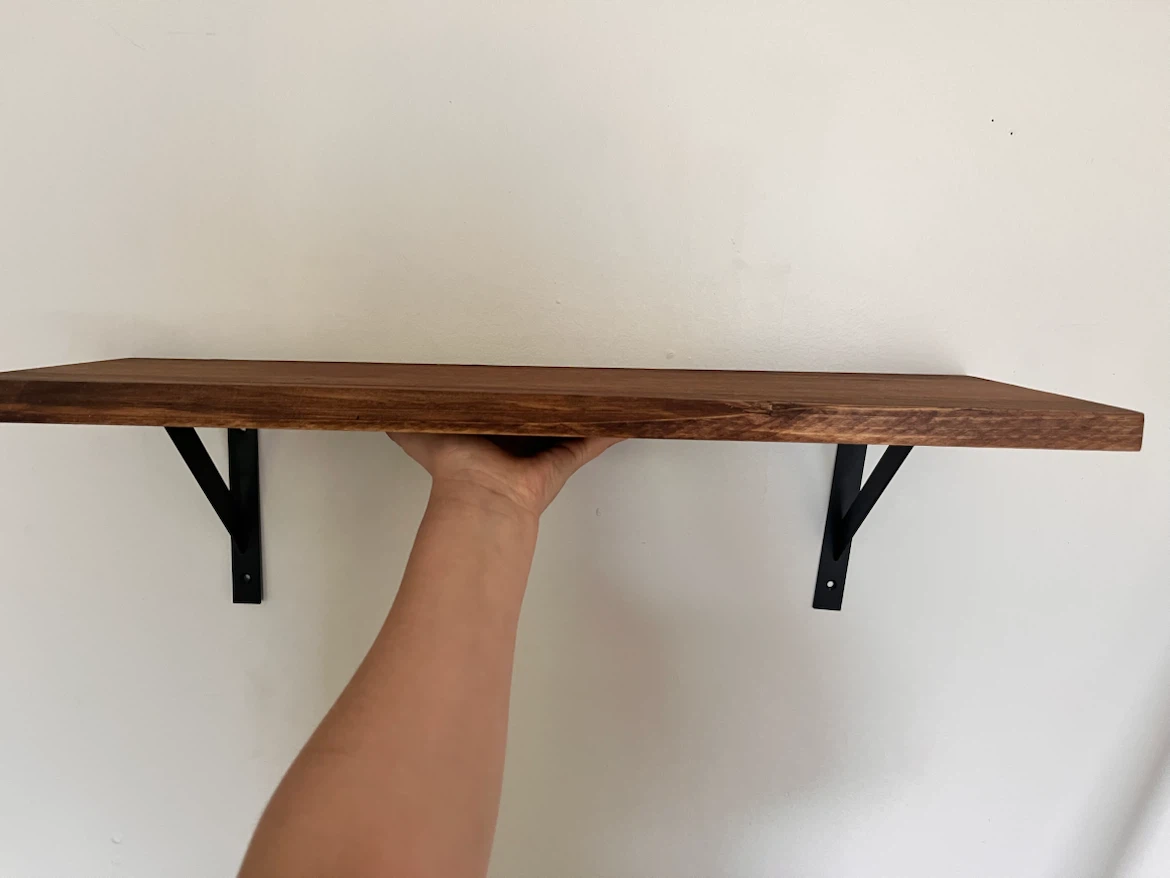 2 rustic floating wall shelves with black metal brackets