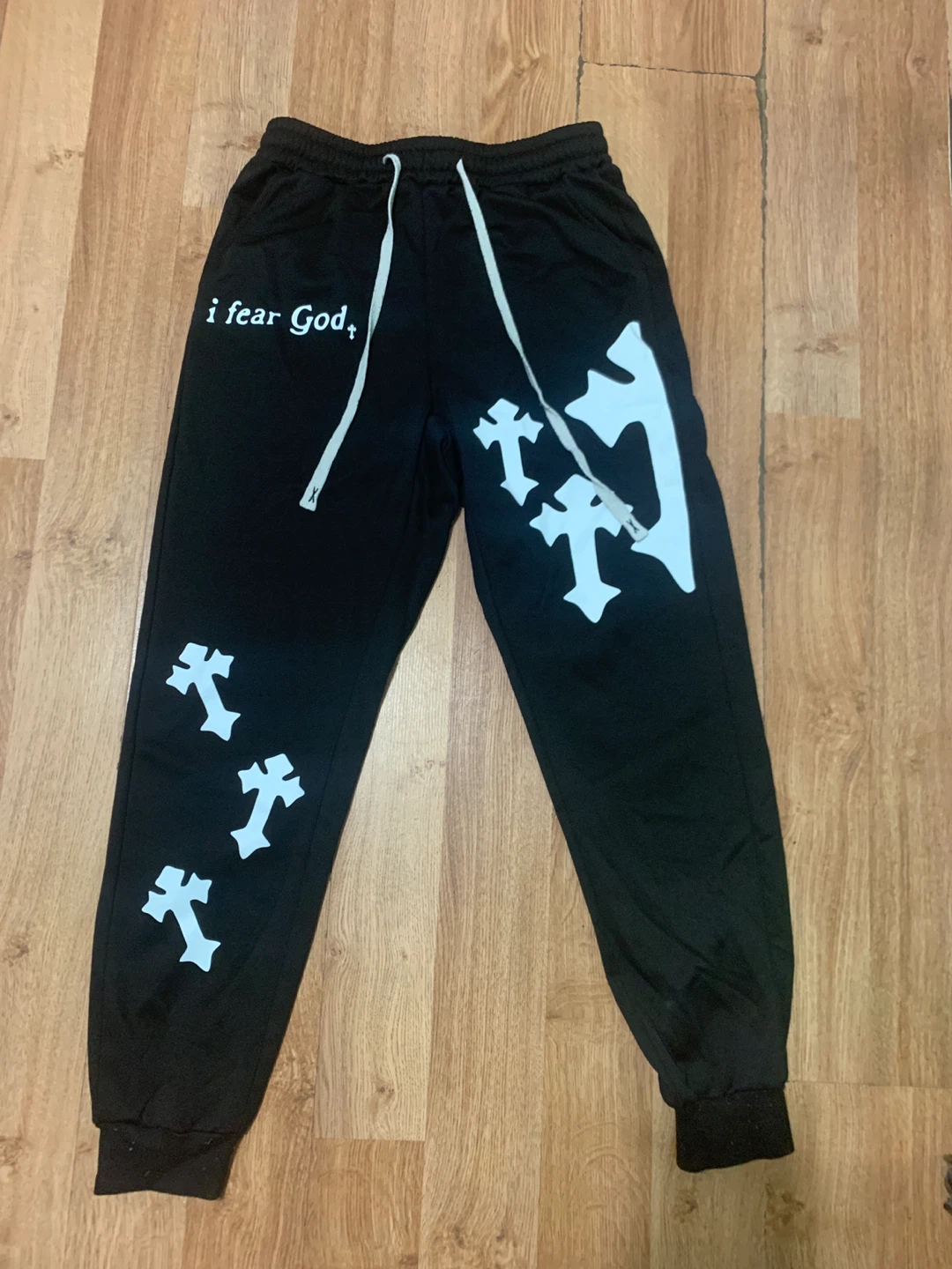 Black sweatpants with 'i fear God' text and cross graphics - photo 2