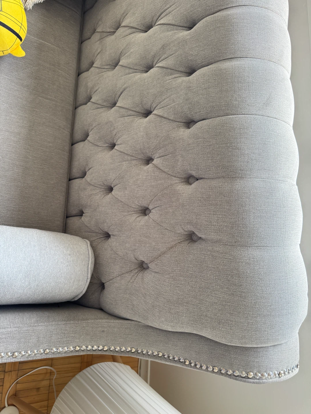 Grey Tufted Sofa with Bolster Pillows