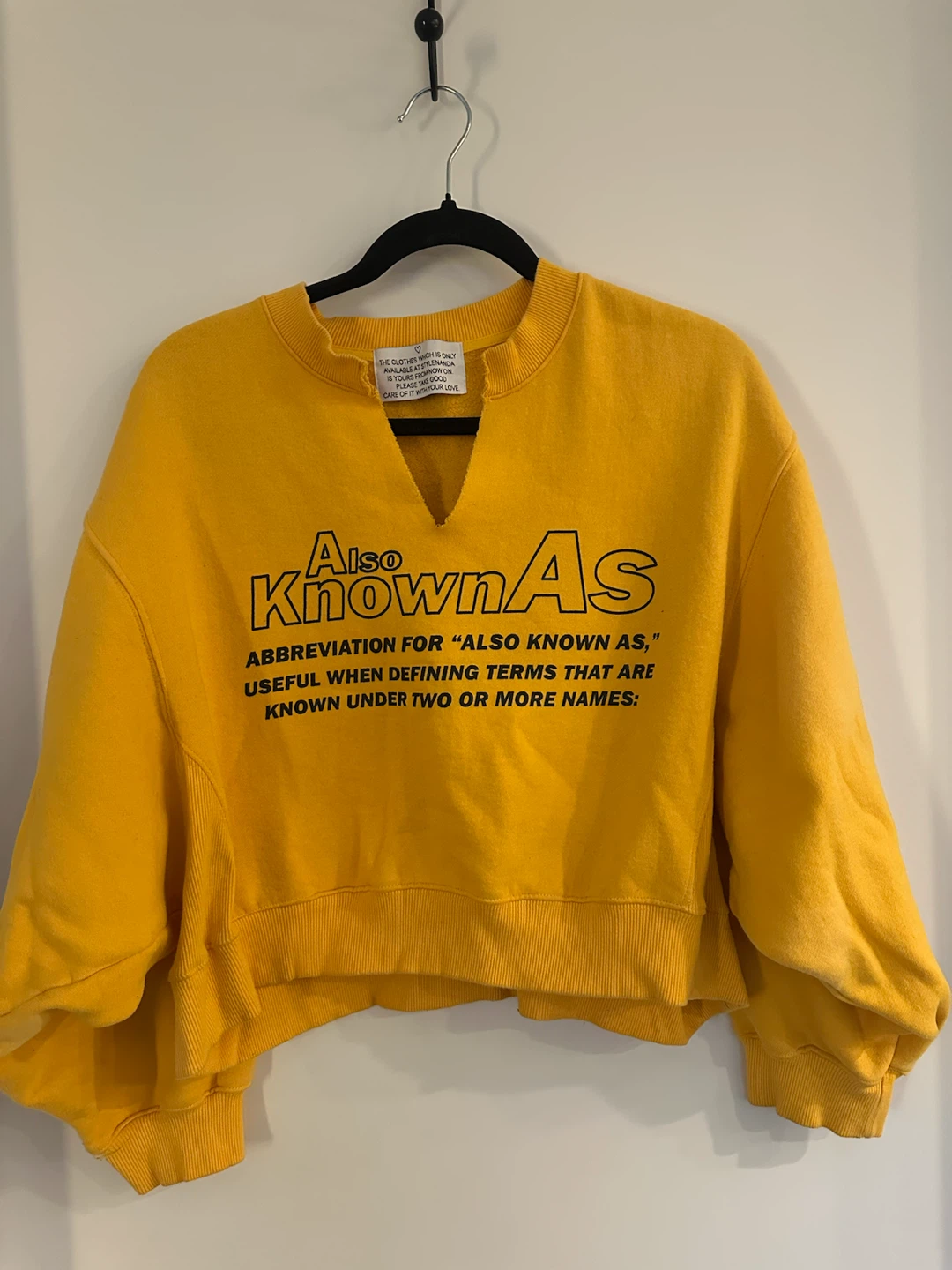 Yellow "Also Known As" Crewneck Sweatshirt