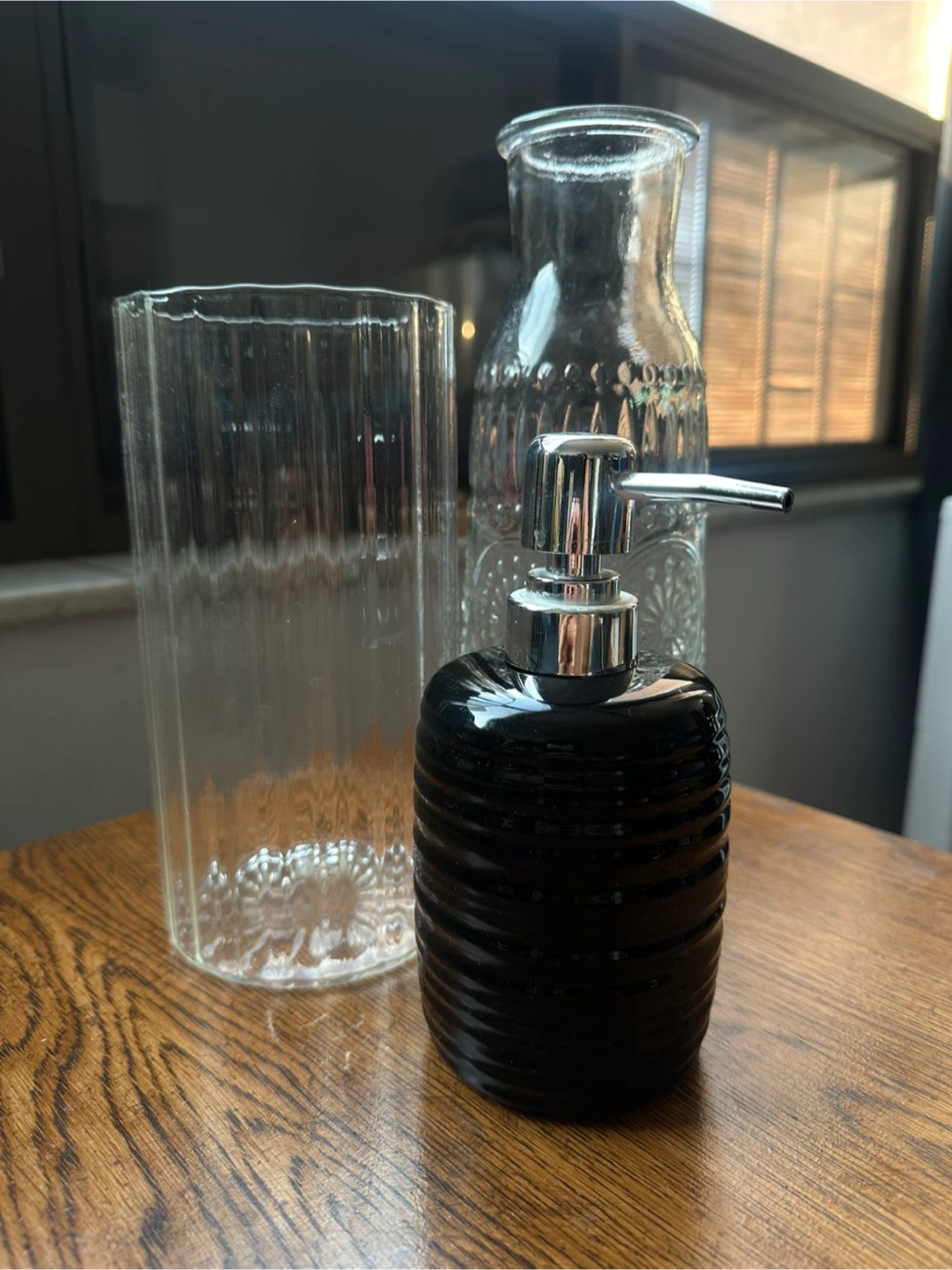 Black ribbed soap dispenser and glass vase set