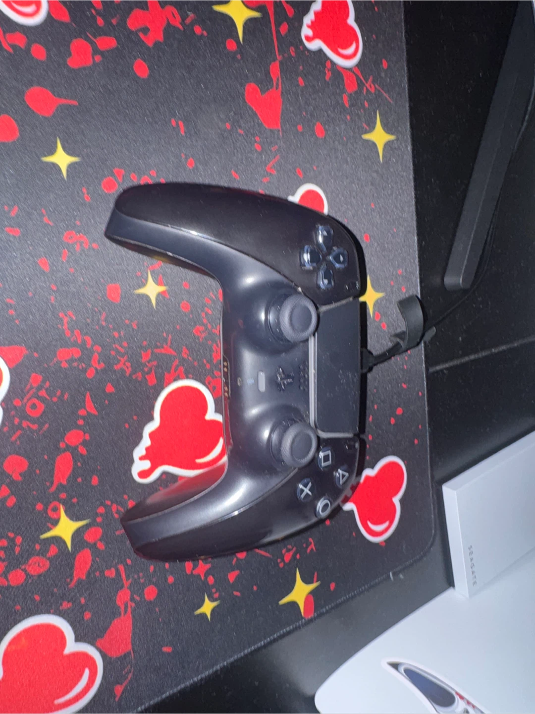 PlayStation 5 with a black and camo controller - photo 3
