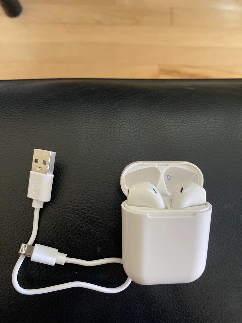 White Wireless Earbuds with Charging Case and Cable