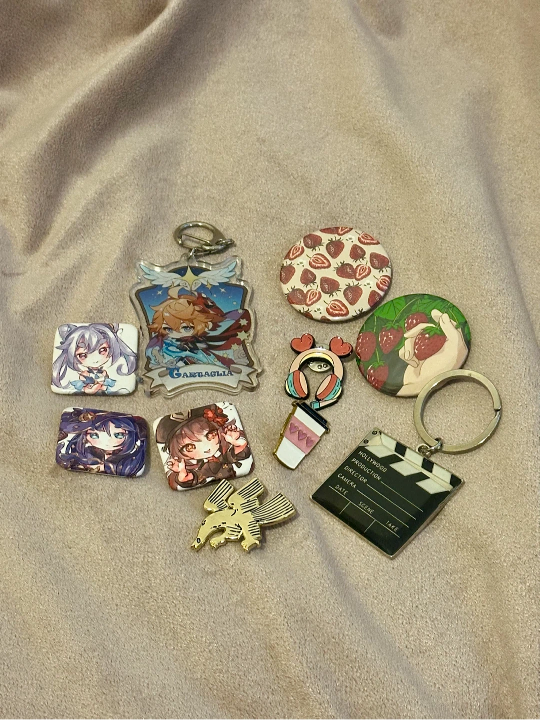 Assorted pins and keychains