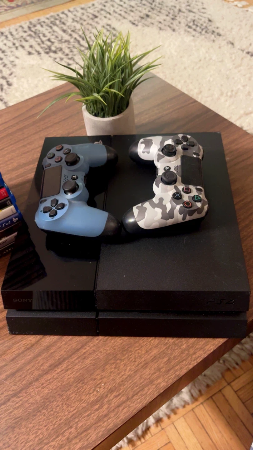 PlayStation 4 Console with 2 Controllers and 12 Games