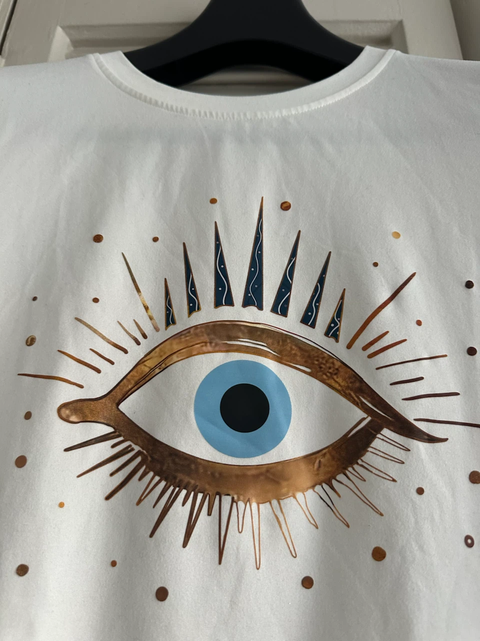 White Graphic T-Shirt with Evil Eye Design