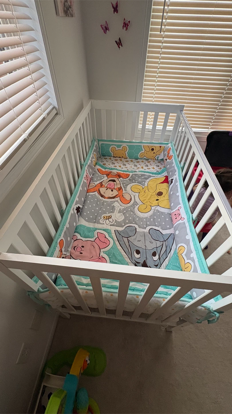 Baby crib with Winnie the Pooh Quilt and Mattress Set