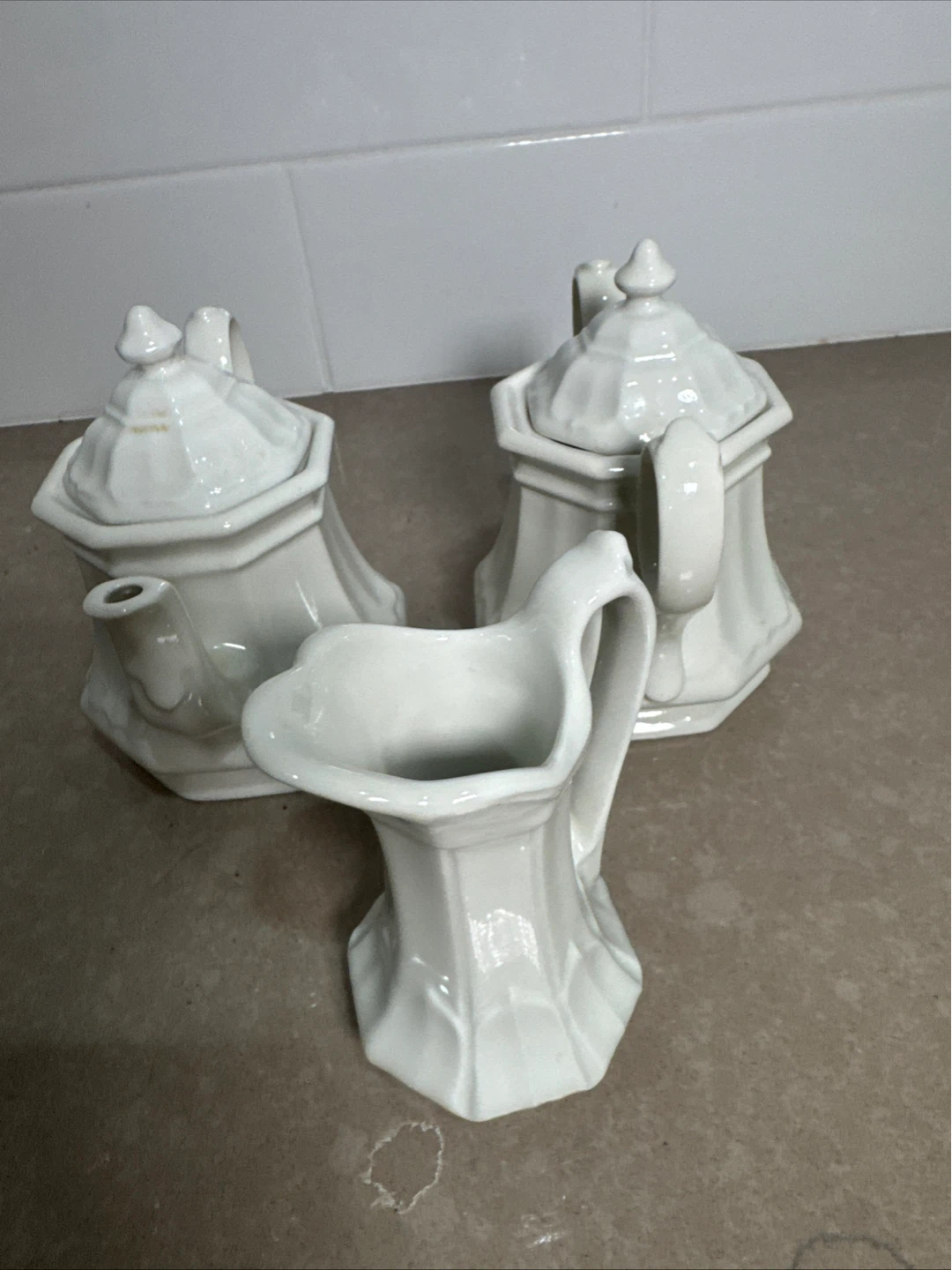 White Ceramic Creamer, Sugar Bowl, and Teapot Set