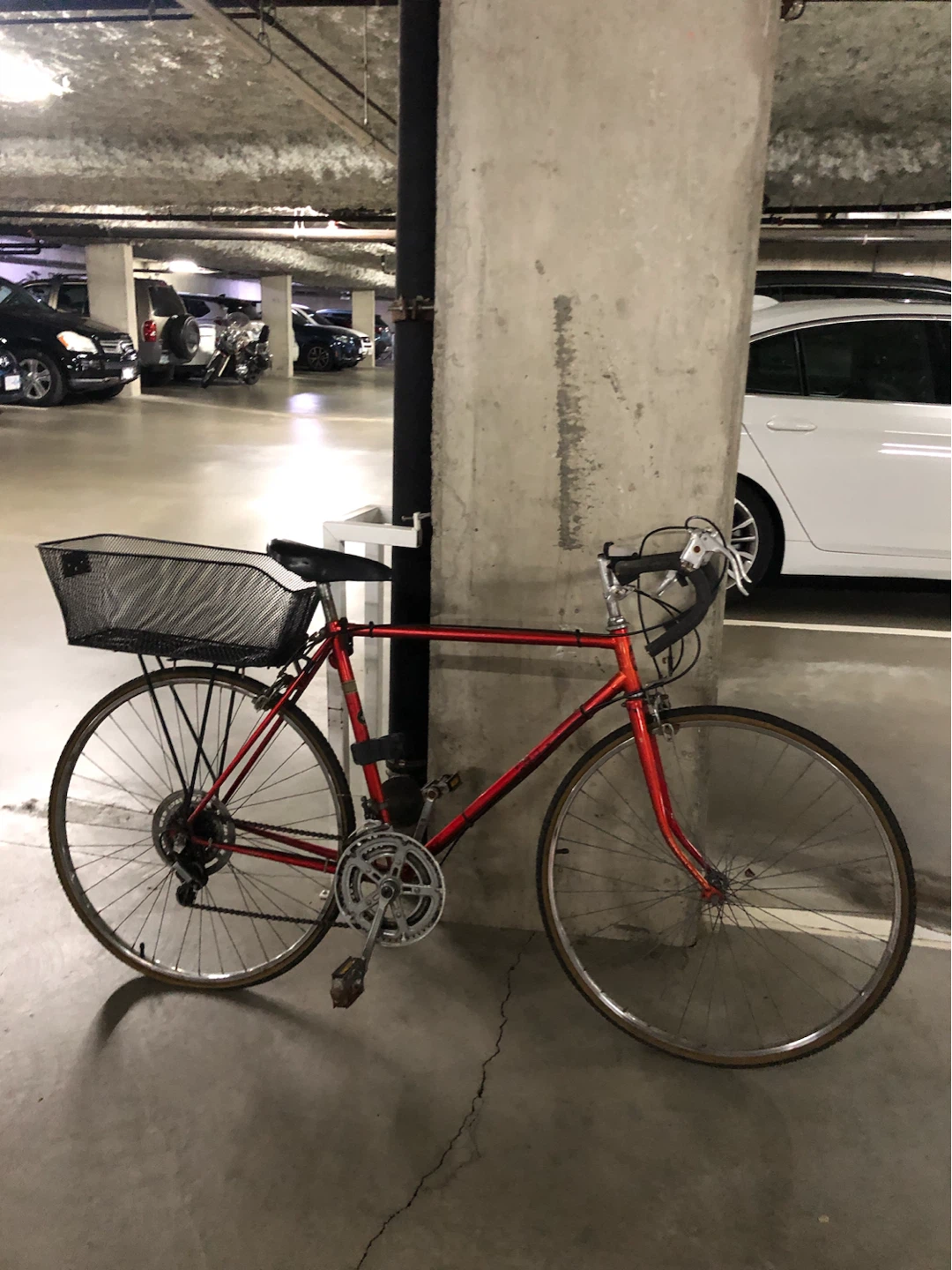 Red road bike with basket