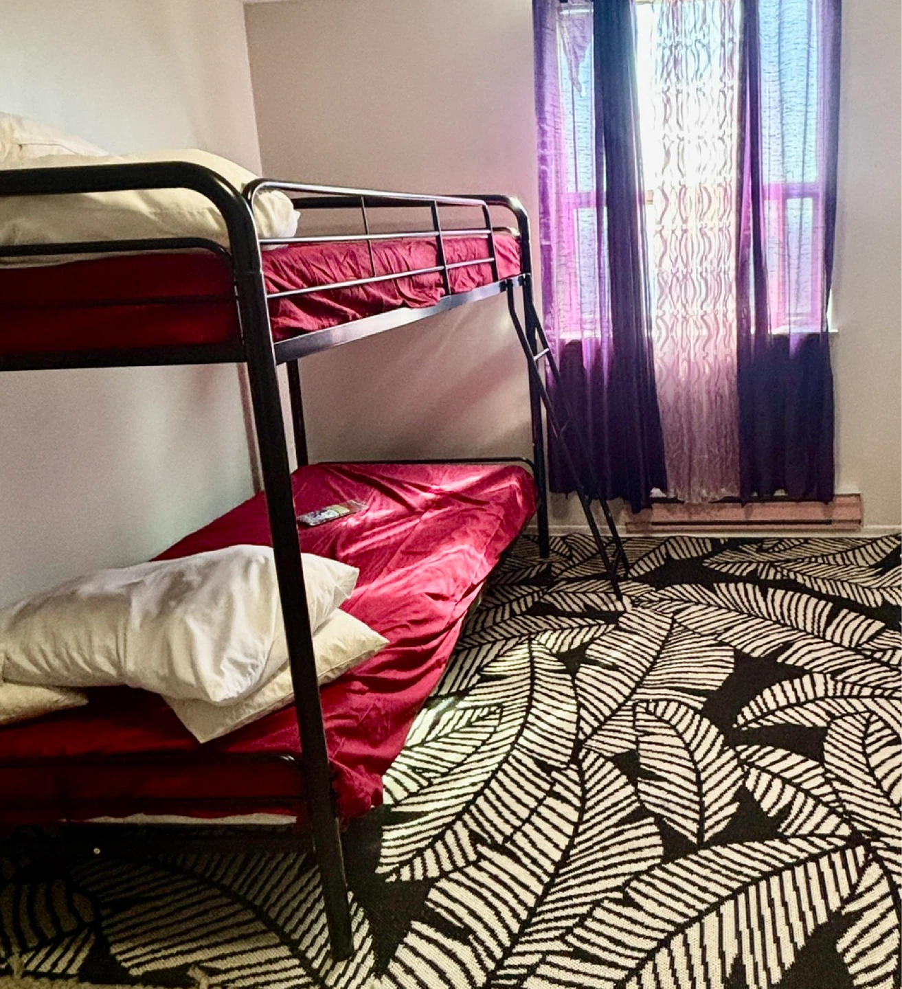 Metal Bunk Bed with Red Mattresses