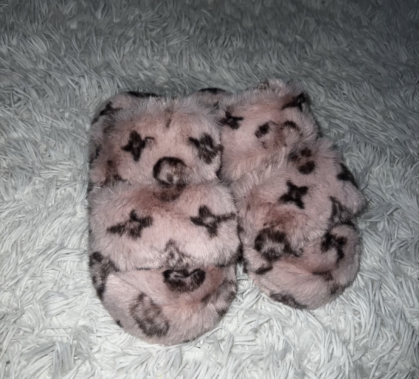 Pink fuzzy slippers with LV monogram print