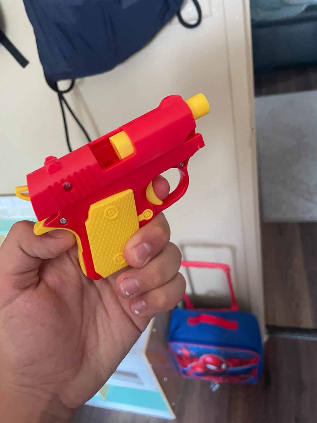 Red and Yellow Toy Cap Gun