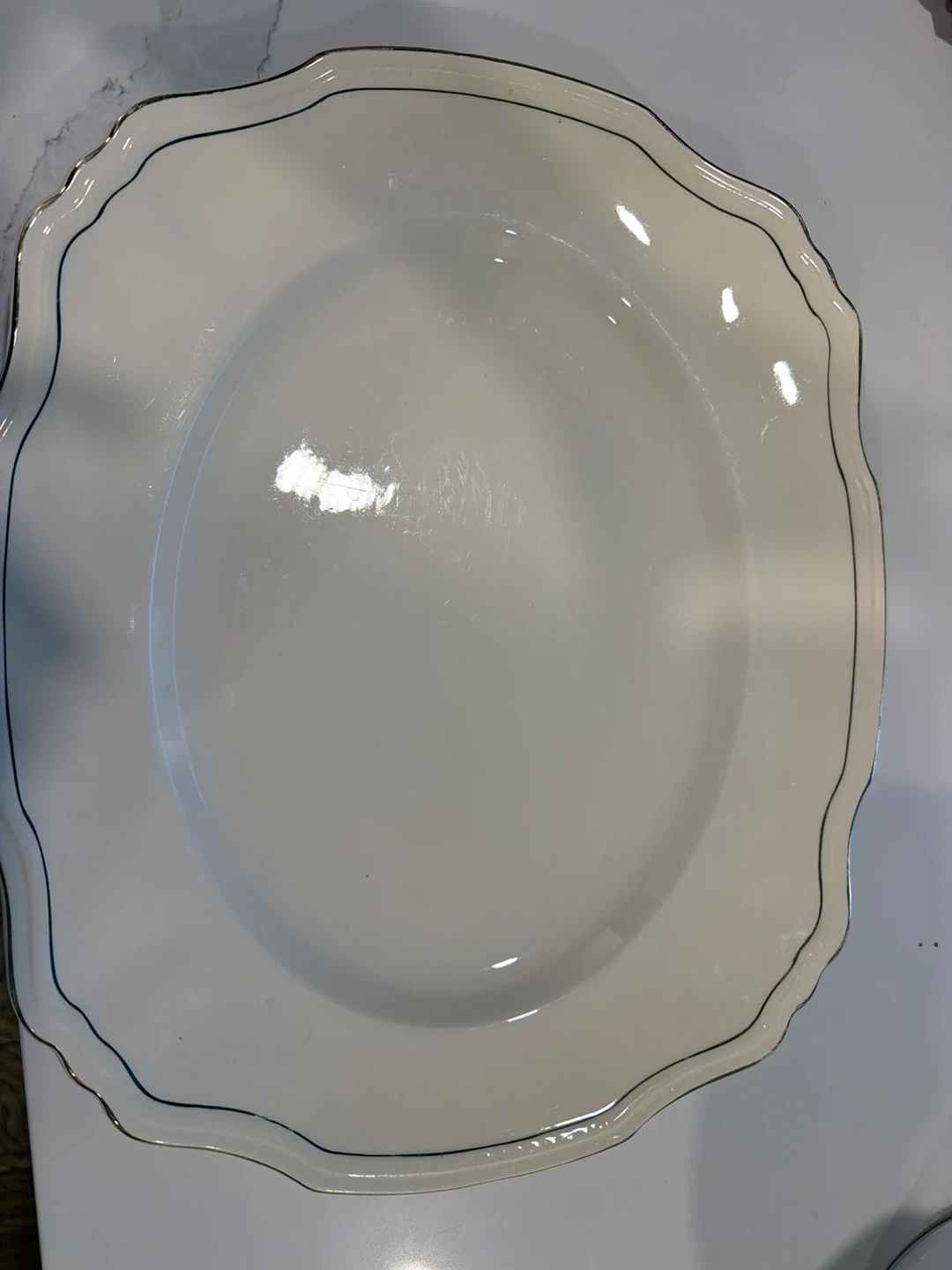 White Scalloped Edge Plate with Blue and Silver Trim