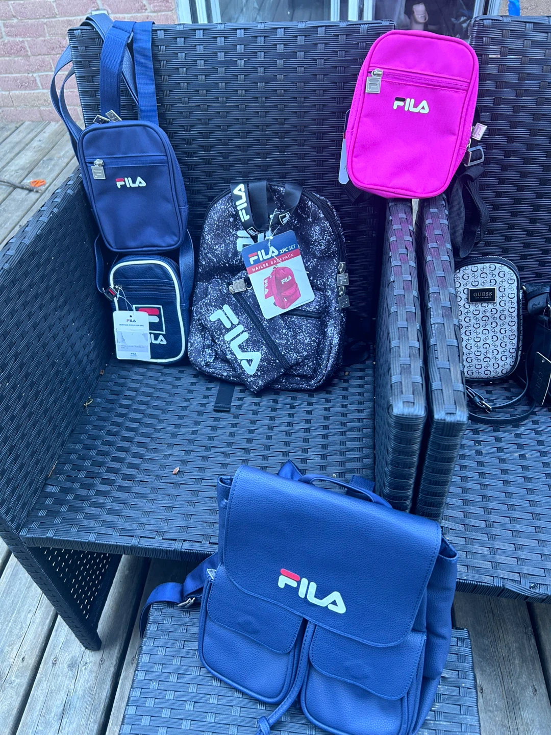 Bundle of 5 bags: 3 Guess, 2 Fila mini backpacks