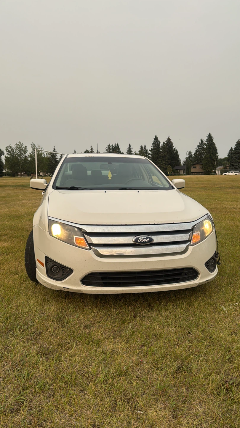 White Ford Fusion Sedan