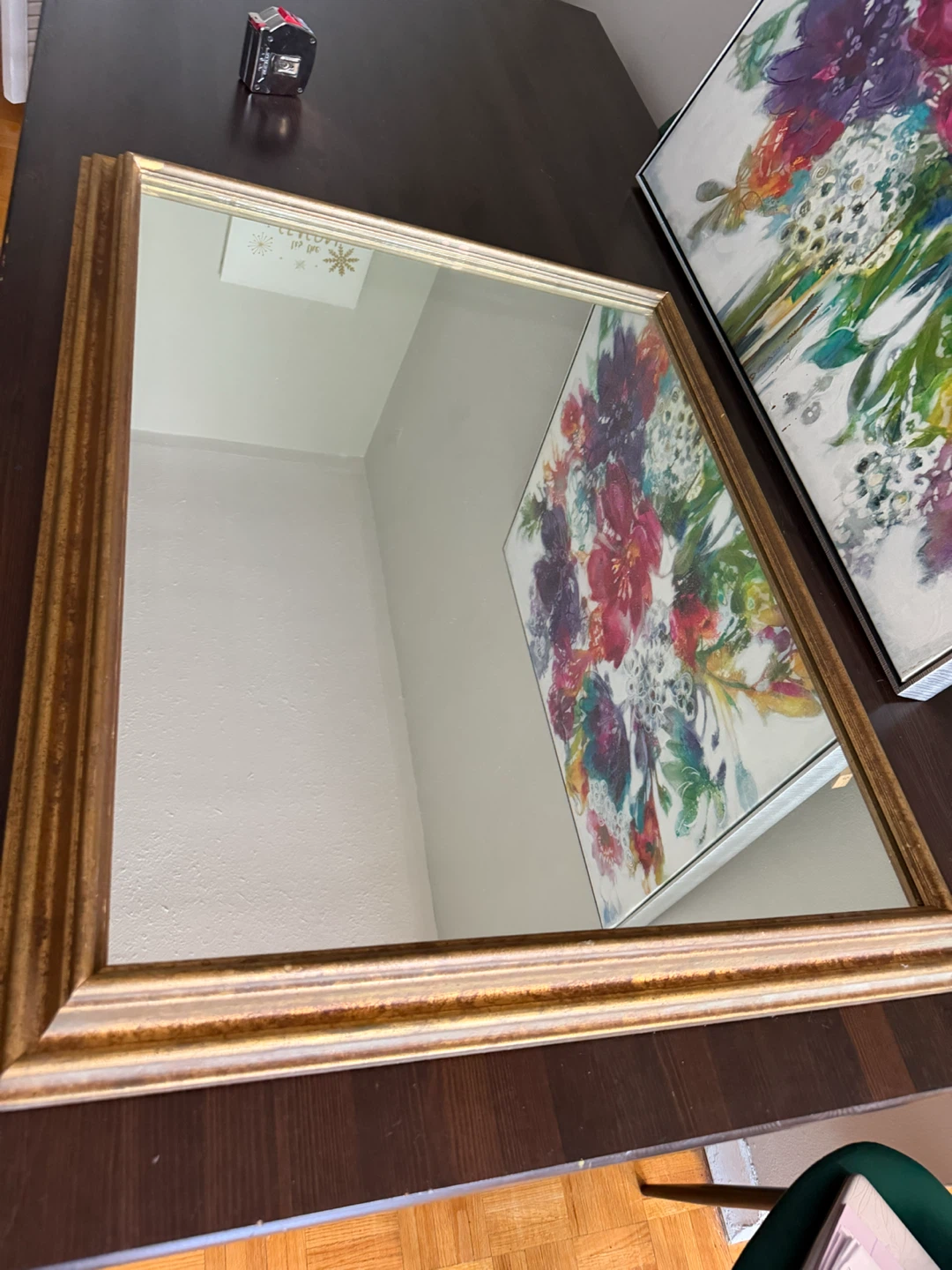 Mirror with gold-toned frame