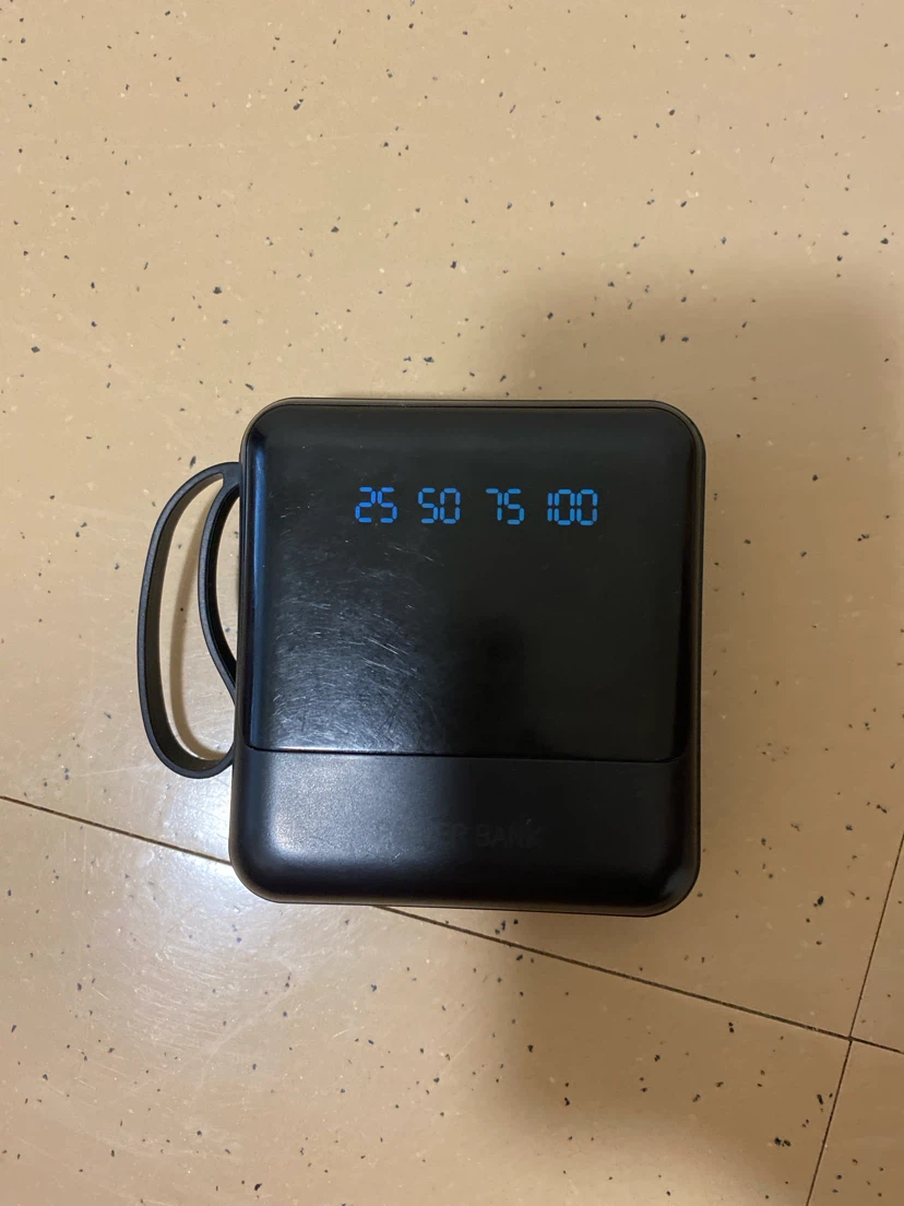 Black Portable Power Bank with Built-in Cables and Flashlight