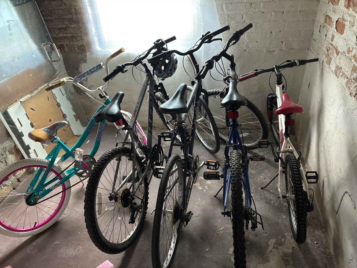 Variety of Kids and Adult Bicycles