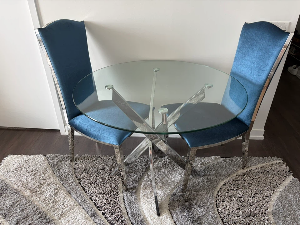 Round Glass Dining Table with 2 Blue Chairs