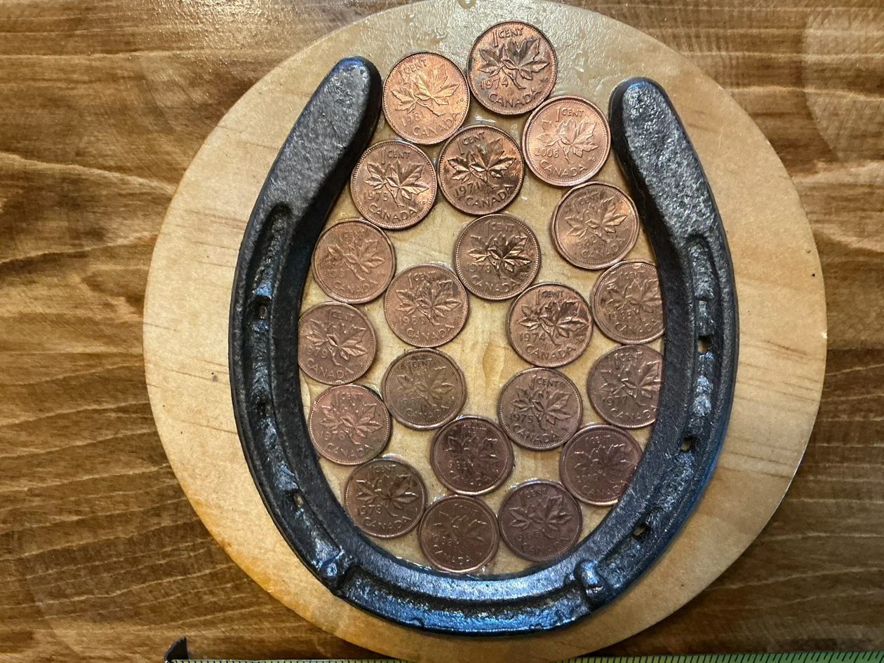 Antique Lucky Horseshoe with Canadian Pennies on Wood Plaque