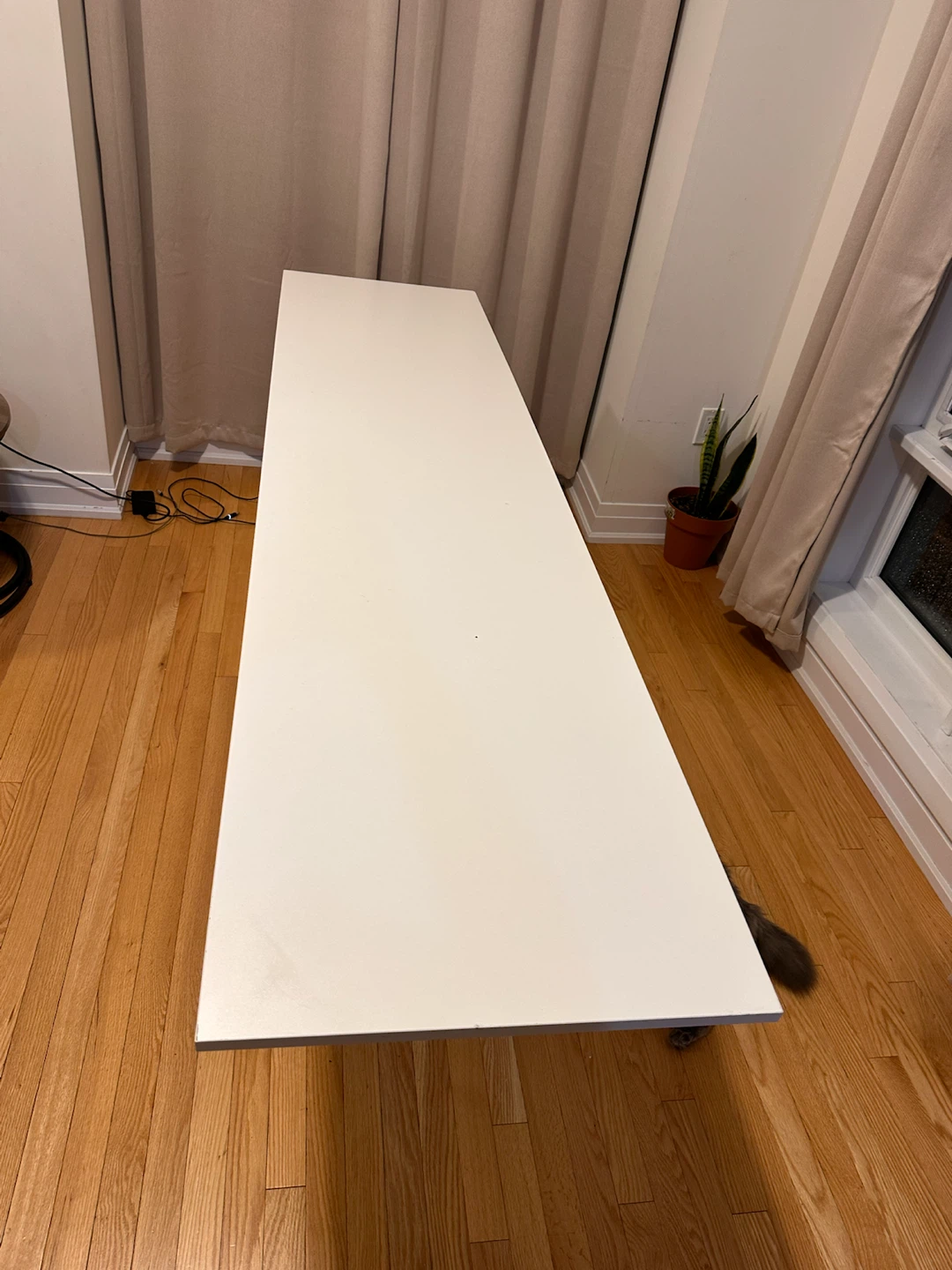 White Table with Black Geometric Legs