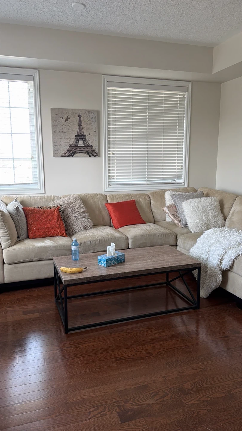 Tan Sectional Sofa with Multiple Pillows