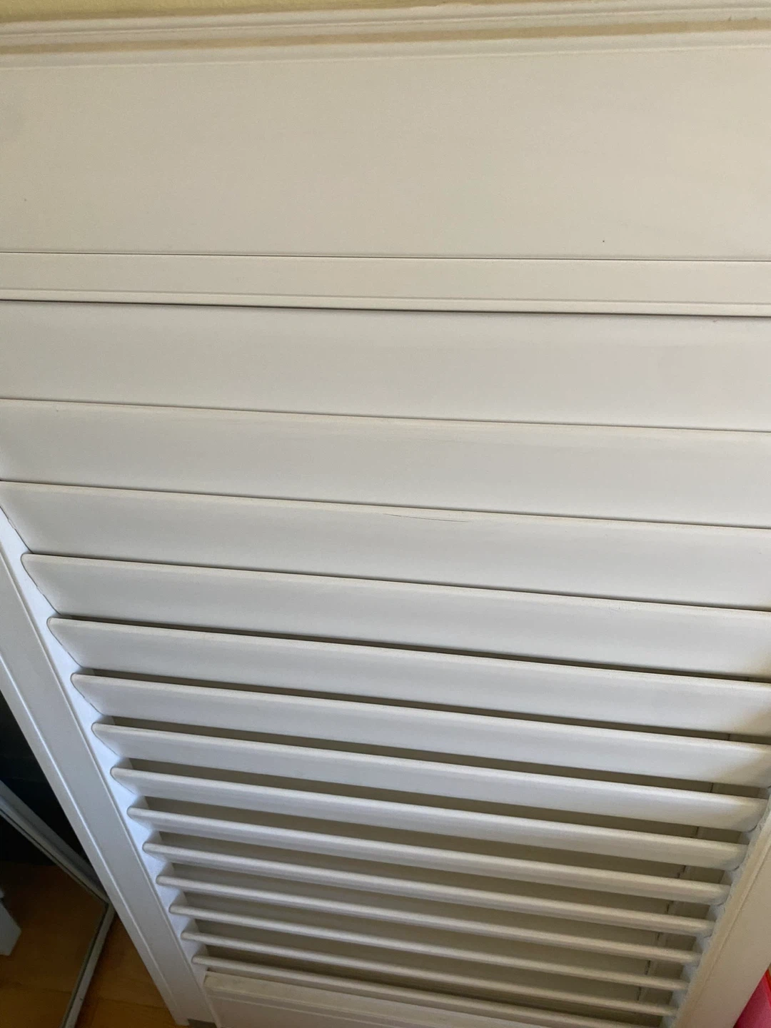 Old white shutter blinds