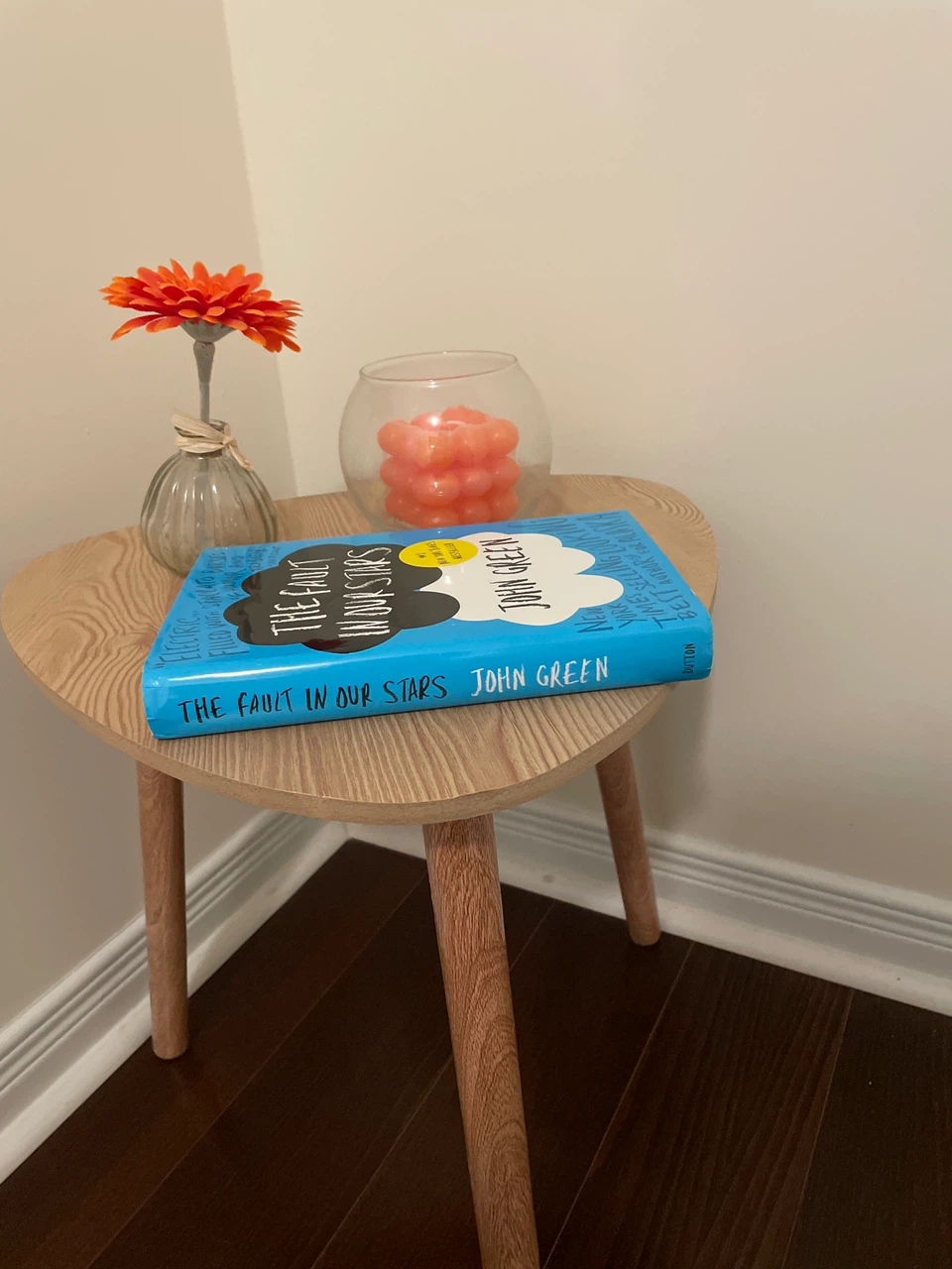 Wooden side Table, candles, book and small artificial flower