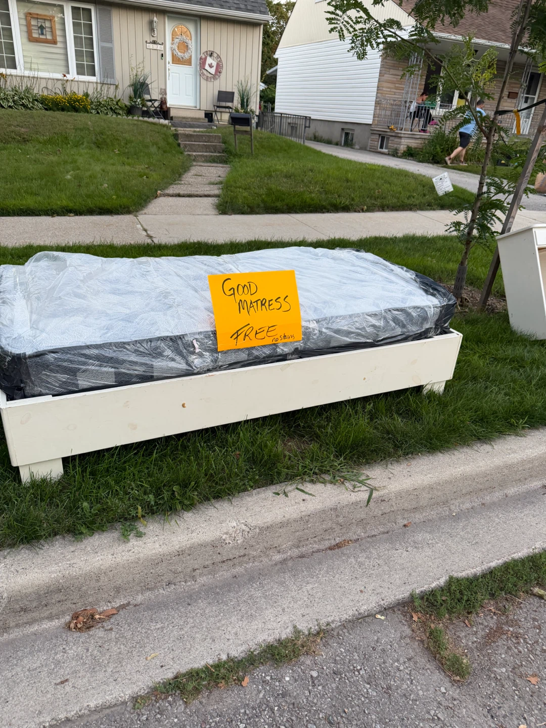 Wooden bed frame and single mattress