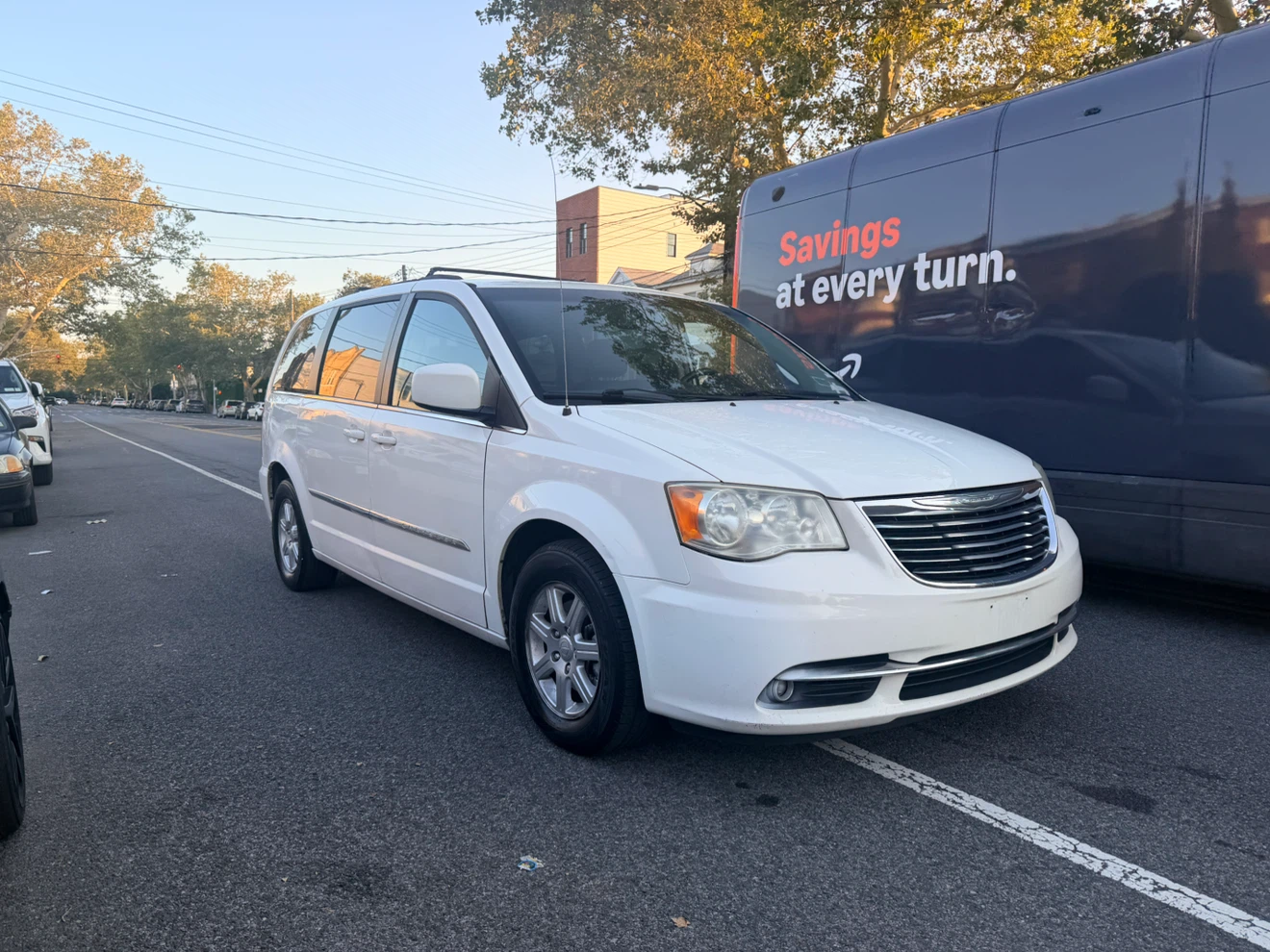 White Chrysler Town & Country Minivan - photo 2