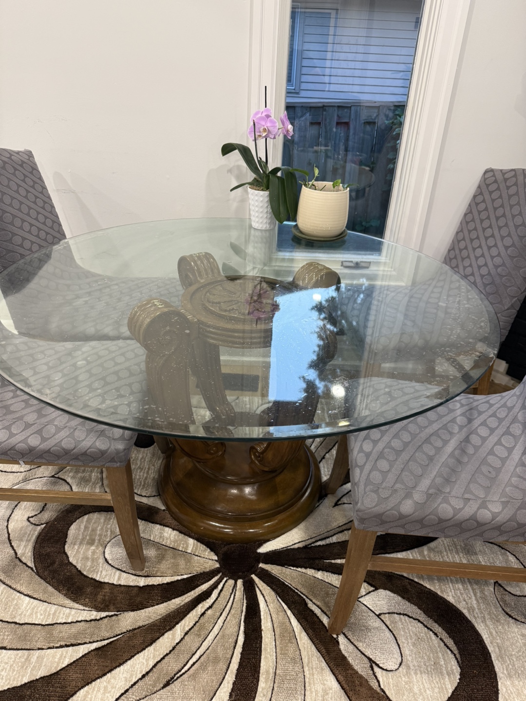 Round Glass Dining Table with Ornate Wood Pedestal Base